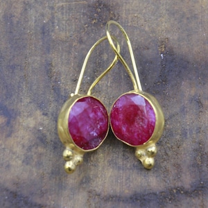 May include: A set of three ceramic mugs with a speckled, matte finish. The mugs are in shades of cream, light gray, and dark gray. Each mug has a simple, minimalist design, perfect for coffee or tea.