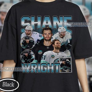 May include: Black t-shirt featuring a collage of images and the name "SHANE WRIGHT" in a teal and white font. The shirt includes multiple photos of a hockey player in various poses and uniforms. The word "Black" is in a white oval at the bottom.