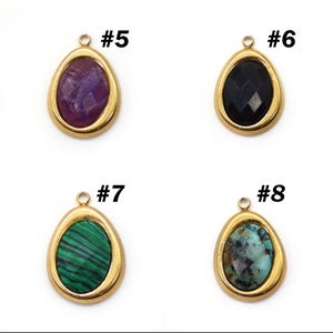 May include: Four teardrop-shaped pendants with gold-colored bezels. Each pendant features a different gemstone: amethyst, black onyx, malachite, and turquoise. Each pendant has a small loop at the top for attaching to a chain or other jewelry component. The pendants are labeled with the numbers #5, #6, #7, and #8.