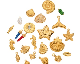 May include: A collection of gold-colored charms in various sea-themed shapes, including seashells, starfish, seahorses, and a whale tail. Some charms have additional colors like red, blue, and pink. The charms are designed for jewelry making.