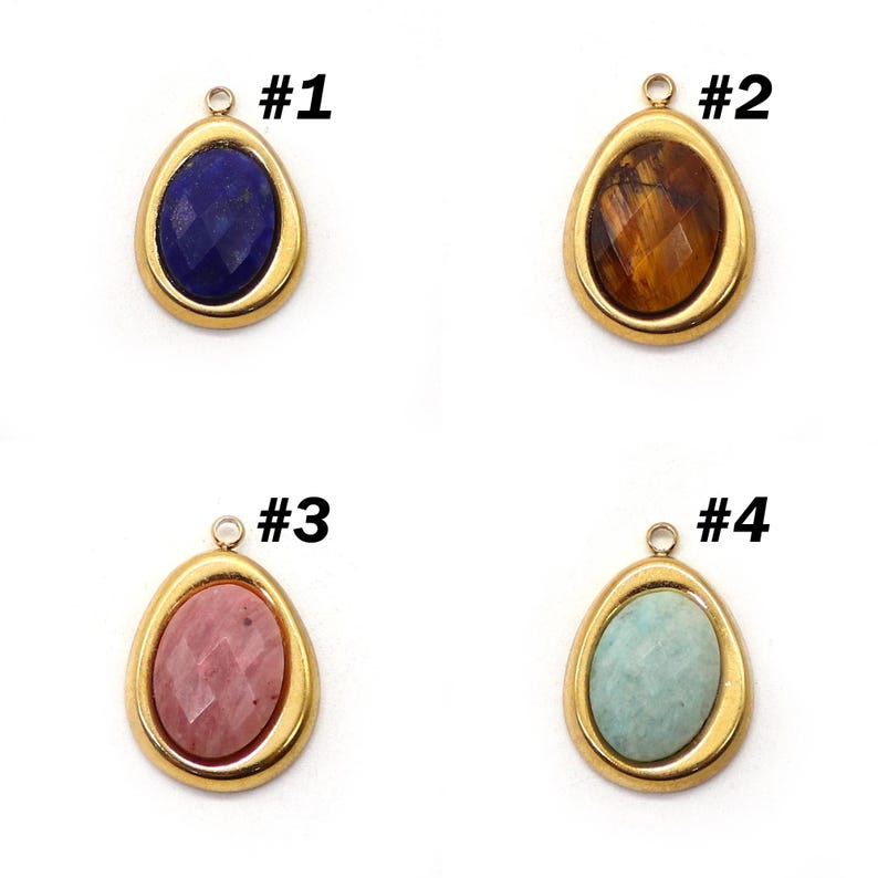 May include: Four teardrop-shaped pendants with gold-colored frames. Each pendant features a different gemstone: a dark blue stone, a brown stone, a pink stone, and a light blue stone. Each pendant has a small loop at the top for attaching to a chain or other jewelry.