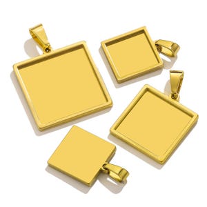 May include: Four gold-coloured square pendants with a loop at the top for a chain. The pendants are in various sizes and have a shiny, reflective surface. The pendants are likely for jewellery making or personalising.