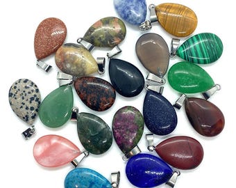 May include: A collection of teardrop-shaped gemstone pendants in various colors and patterns. The pendants have silver-colored metal bails for attaching to a chain. The gemstones include shades of green, blue, brown, and red, with unique textures and veining.