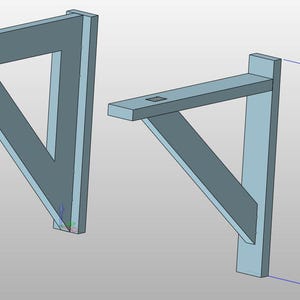 May include: Two gray metal shelf brackets with a triangular design. One bracket has a hole near the top. The other bracket has a rectangular notch on the top. The height of the bracket is 350.00.