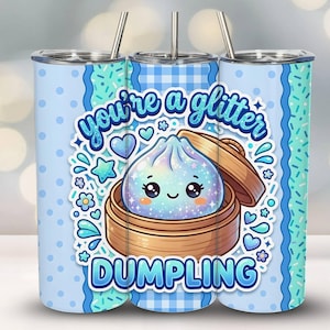 May include: A stainless steel tumbler with a whimsical design. The tumbler features a cartoon dumpling character with the text "you're a glitter DUMPLING". The design includes blue polka dots, hearts, stars, and flowers. The tumbler has a silver straw.