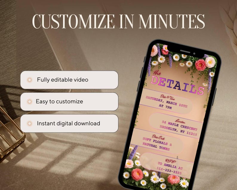 May include: A smartphone displays a digital invitation with floral accents. The text reads "the DETAILS" and includes event details like date, time, and location. Additional text highlights features: "Fully editable video," "Easy to customize," and "Instant digital download."