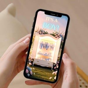 May include: A smartphone displays a digital image with the text "IT'S A BOY!" above a white wardrobe filled with baby clothes. The scene is surrounded by flowers, suggesting a baby shower or announcement.