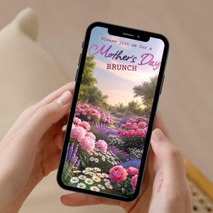 May include: A smartphone displays a Mother's Day Brunch invitation. The screen shows a vibrant garden scene with pink and purple flowers, palm trees, and the text "Please join us for a Mother's Day Brunch."
