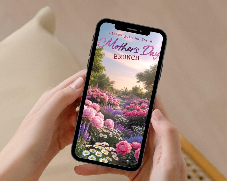 May include: A smartphone displays a Mother's Day Brunch invitation. The screen shows a vibrant garden scene with pink and purple flowers, palm trees, and the text "Please join us for a Mother's Day Brunch."