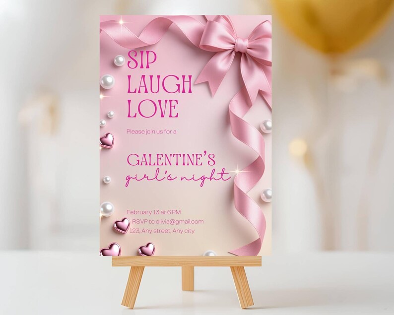 May include: A pink Galentine's Day invitation on a small wooden easel. The invitation features pink text that reads "SIP LAUGH LOVE" and "GALENTINE'S girl's night." The design includes a pink ribbon, pearls, and heart accents.