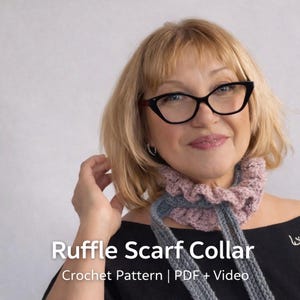 May include: A crochet ruffle scarf collar in shades of pink and gray. The scarf has a ruffled edge and long ties. The text "Ruffle Scarf Collar" and "Crochet Pattern | PDF + Video" is visible.