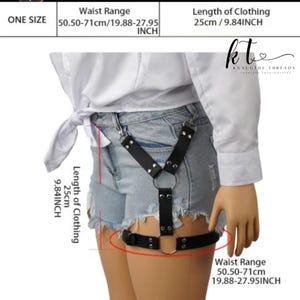 May include: Black faux leather body harness with silver-tone hardware. The harness has adjustable straps and a large metal ring. Waist range is 50.50-71cm, and the length of the clothing is 25cm. The text "KNAUGHY THREADS" is visible.
