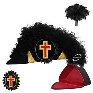May include: A black hat with a red cross emblem, surrounded by black feathers. The hat has gold trim and is accompanied by a matching emblem and a black carrying case with a red interior.