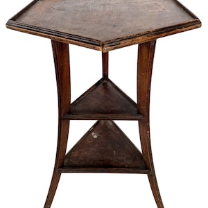 May include: A hexagonal wooden table with three shelves. The table has a dark brown finish and curved legs.