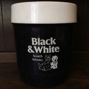 May include: A white and black insulated cooler with a black and white image of two dogs and the text "Black & White Scotch Whisky".