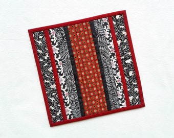 Striking red and black modern patchwork table square, cabin chic candle mat, modern farmhouse placemat