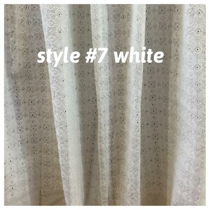 May include: White sheer curtains with an embroidered pattern. The curtains have a text label that reads "style #7 white".