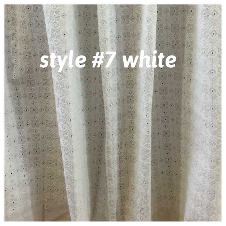 May include: White sheer curtains with an embroidered pattern. The curtains have a text label that reads "style #7 white".