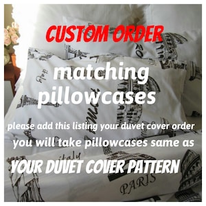 May include: White pillowcases with a black and white print of landmarks from Paris, Rome, and Italy. The text "CUSTOM ORDER matching pillowcases" is written in red letters. The text "please add this listing your duvet cover order you will take pillowcases same as YOUR DUVET COVER PATTERN" is written in black letters. The text "PARIS" and "italy" are also written in black letters.