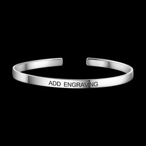 May include: A silver cuff bracelet with the text "ADD ENGRAVING" engraved on the front. The bracelet has a simple, open design and is set against a black background.