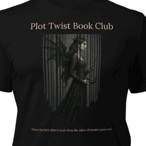 May include: Black t-shirt featuring the text "Plot Twist Book Club" in a serif font. The design includes an illustration of a woman with wings. The text "Where the fairy dust is made from the ashes of enemies (and exes)" is at the bottom.