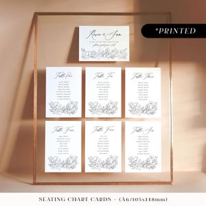 Simple black large seating chart sign with flowers, floral sketch printed table plan board, classic monochrome wedding seating plan cards