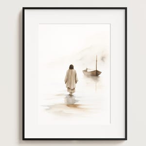 May include: Framed watercolour print. The image shows a figure in a long robe walking in water towards a small boat. The artwork has a soft, muted colour palette with a focus on light and reflection.