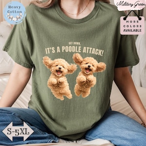 May include: Military green t-shirt featuring the phrase "GET DOWN, IT'S A POODLE ATTACK!" and a graphic of two smiling toy poodles. Available in sizes S-5XL, the shirt is made of heavy cotton.