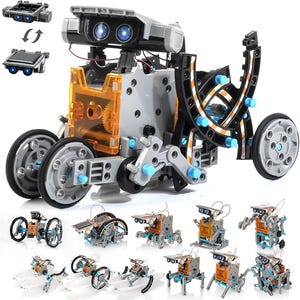 Könnte beinhalten: Ein solarbetriebenes Roboter-Kit mit mehreren Bauoptionen. Der Hauptroboter hat einen grau-schwarzen Körper mit orangefarbenen Akzenten, große Räder und ein Solarpanel. Kleinere Robotervarianten werden ebenfalls gezeigt.