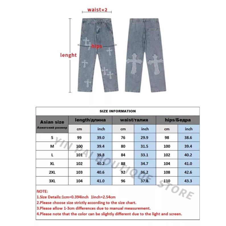 May include: Light blue denim jeans with cross-shaped embellishments. The jeans have a classic five-pocket design and a straight leg. Size chart included with measurements in inches and centimeters. The length is 39.0 inches (99 cm) for size S.