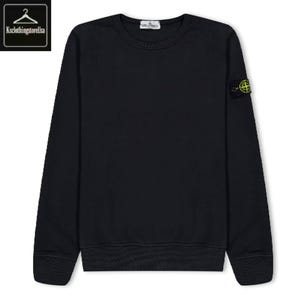 May include: A black crew neck sweatshirt with long sleeves. A small patch with a green and yellow logo is on the left sleeve. The sweatshirt has a ribbed neckline, cuffs, and hem. The brand name is on the tag.