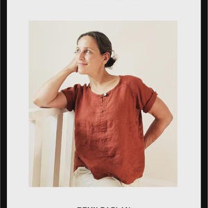 May include: A woman wearing a rust-colored linen top, part of the Remy Raglan sewing pattern. The image includes the text "SEW HOUSE SEVEN" and "SEWING PATTERNS." The pattern is for standard sizes 00-20 and curvy sizes 14-34, suitable for confident beginners.