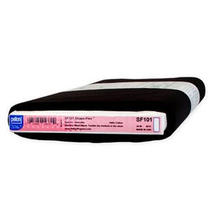 May include: A bolt of black Pelon SF101 Shape-Flex fabric wrapped in a white paper band. The label displays the text: Pelon SF101 Shape-Flex, Apparel-Specialty, 100% Cotton, Machine Wash Warm, Tumble dry medium or dry clean, 20 IN, MADE IN USA.