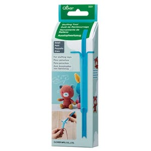 May include: A Clover brand small stuffing tool in a light blue plastic material, packaged in a vertical cardboard box. The packaging features the text Stuffing Tool, Small, and For stuffing toys, with illustrations of crocheted teddy bears.