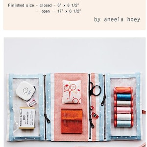 May include: Open Make And Go Pouch with sewing supplies. Closed size is 6" x 8 1/2", open is 17" x 8 1/2". Includes a tape measure, pins, scissors, needles, thread spools, and a pin cushion. The pouch is blue and white with a zipper.
