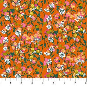 May include: Orange fabric with a floral pattern featuring white, pink, and yellow flowers, along with green stems and leaves. The design is repeated across the fabric. A ruler is at the bottom of the image, showing measurements in inches.