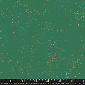 May include: Green fabric with a speckled pattern. The fabric has a dark green background with small, scattered dots in shades of orange, blue, and white. The text "RUBY STAR SOCIETY" is at the bottom.