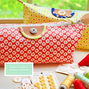 May include: Two zippered pouches with floral patterns, one red with white flowers and one yellow with white flowers. The pouches are on a white surface with buttons, spools of thread, and a card with the text "Crane Craft". The text "My Travel Bag" is at the top of the image. The text "Perfect for notions, makeup or jewelry!" is on a green rectangle. The text "FIG TREE & CO. by Joanna Figueroa" is at the bottom of the image.