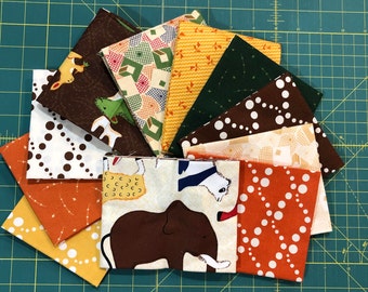 Doodle Zoo Fat Quarter Bundle of 11 prints in brown, orange, and green by Thimbleberries for RJR Fabrics