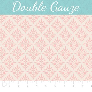 May include: A seamless pattern of pink floral sprigs on a cream background. The pattern is repeated throughout the image. The text "Double Gauze" is written in a decorative font at the top of the image.