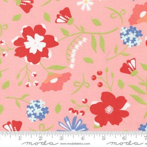 May include: Pink fabric with a floral pattern featuring red, white and blue flowers, butterflies and leaves. The fabric is marked with a ruler and the text "moda" appears twice.
