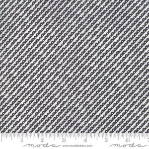 May include: White fabric with a black and white diagonal pattern of scalloped lines and small dots. The fabric is marked with a ruler and the words "moda" and "www.modafabrics.com".