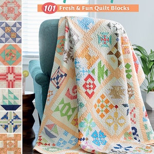 May include: A book titled "Sampler Spree: 101 Fresh & Fun Quilt Blocks" by Susan Ache. The book cover features a colorful quilt with various patterns and colors, including red, blue, green, and yellow. The quilt is draped over a teal armchair.