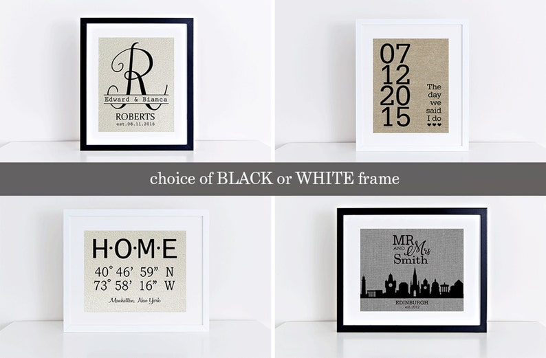 May include: Four framed prints with different designs on a white background. The prints are in black and white frames. The first print has a large letter R with the text "Edward & Bianca Roberts est. 08.31.2016". The second print has the text "07 12 20 15 The day we said I do". The third print has the text "HOME 40&deg; 46' 59" N 73&deg; 58' 16" W Manhattan, New York". The fourth print has the text "MR. & Mrs. Smith EDINBURGH est. 2012" and a silhouette of the Edinburgh skyline.