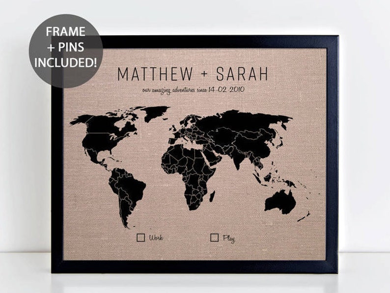 May include: A black framed world map with a beige linen background. The map is titled "Matthew + Sarah our amazing adventures since 14-02-2010". There are two checkboxes labeled "Work" and "Play".