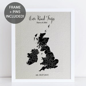 May include: A black and white map of the United Kingdom with the text "Our Road Trips Harry & Mel est. 30.07.2015" printed below the map. The map is framed in a white frame.