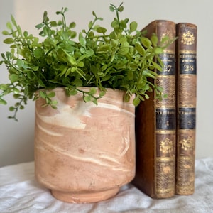 May include: A rustic wooden sign with the text "Welcome to our home" in a handwritten style. The sign features a distressed finish and a simple, inviting design, perfect for a front porch or entryway.