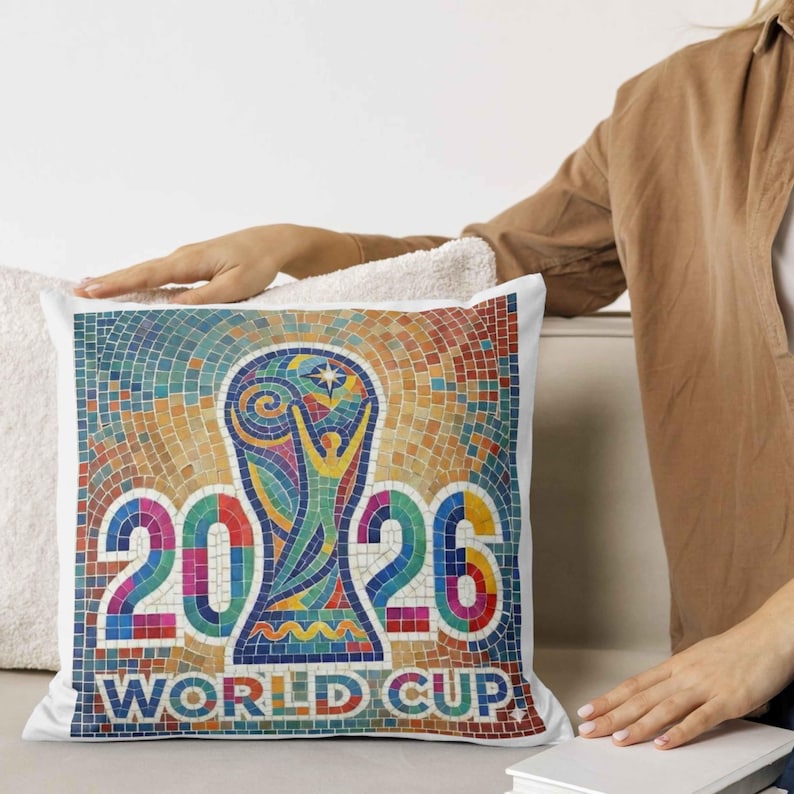 Square cushion on sofa printed with colorful stained glass soccer design.