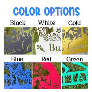 May include: A display of metal garden signs in various colors: black, white, gold, blue, red, and green. Each sign features a unique design with cut-out floral or mushroom motifs and text. The text "COLOR OPTIONS" is displayed at the top.