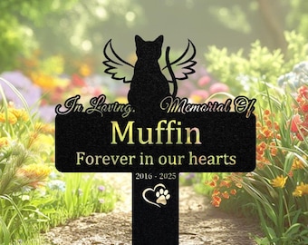 May include: Black metal pet memorial stake with a cat silhouette, angel wings, and the name "Muffin." The stake reads "In Loving Memorial Of" and "Forever in our hearts" with the years 2016-2025 and a paw print heart.